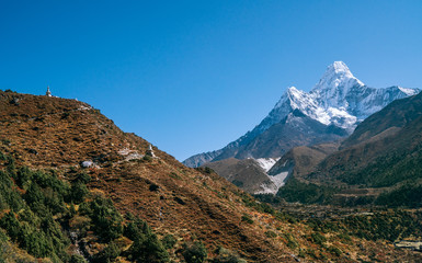 Ama Dablam 6814m peak covered with snow and ice. Imja Khola valley in  Sagarmatha National Park. Everest Base Camp (EBC) trekking route.