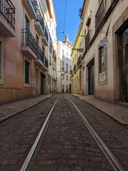 Naklejka na ściany i meble narrow street in old town of lisbon portugal Europe