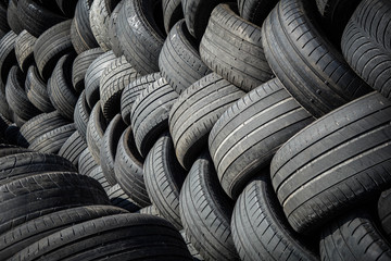 Old tires collected outdoors for recycling - 307033957
