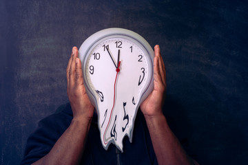 Time is running out concept shows clock that is melting away from an african american man's head