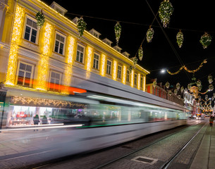 Fototapeta na wymiar Beautiful Christmas decorations on Herrengasse street, at night, in the city center of Graz, Styria region, Austria