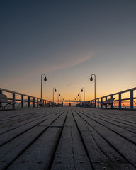 Fototapeta na wymiar Frosted pier at sunrise
