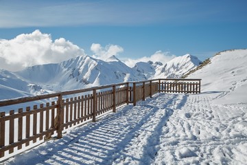 Outdoor terrace in a ski resort with beautiful panorama view cevered with snow