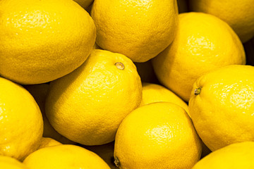 Lot of ripe juicy yellow lemons for making refreshing healthy lemonade drink. Organic fruits full...