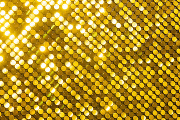 Naklejka premium Sequins reflective background. golden Sequins wall, Sparkling