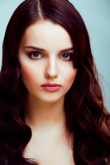 Fototapeta premium young pretty brunette woman with hairstyle waves, luxury look fashion makeup close up