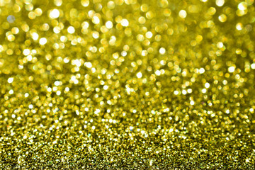 sparkles of golden glitter texture background