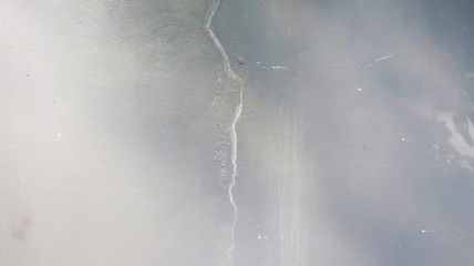 crack of gray concrete wall for background texture