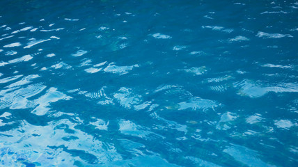 Fototapeta na wymiar blue water in the pool close up for background