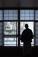 Man wearing yukata at traditional Ryokan in winter　冬の温泉旅館 浴衣の日本人男性