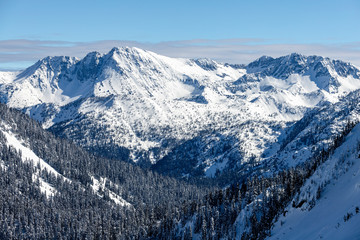 Epic Snowy Mountain Cliffs in Cascade Range on Sunny Day