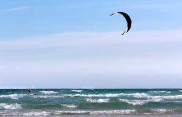 Seascape with kite against sky as background