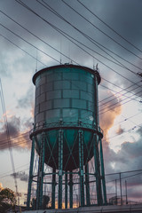 water tower with clouds