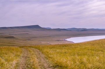 steppe yellow autumn grass path lake