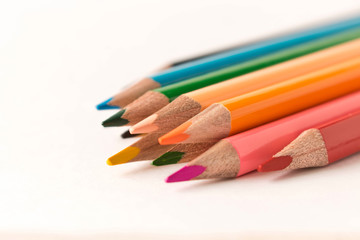 Fototapeta premium A set of colored pencils. Isolated on white background. Selective focus.