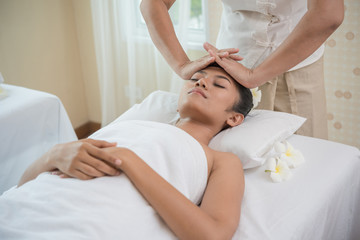 Fototapeta na wymiar young woman getting spa treatment at beauty salon. spa face massage. facial beauty treatment. spa salon.
