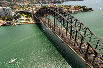 Fototapeta premium Sydney harbour bridge with Australian flags looking north aerial