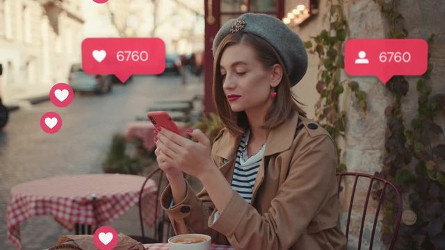 Portrait young woman with red lipstick wearing hat coat sitting in cafe breakfast use phone social media icons like comment follower counter quick increase influencer blog portrait outdoors slow