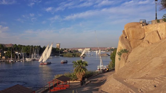Beautiful landscape with felucca boats on Nile river in Aswan at sunset, Egypt, 4k