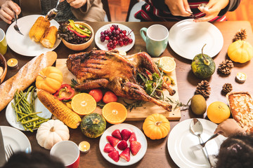 Roasted  chicken or turkey with sauce and grilled autumn vegetables: corn,pumpkin  on wooden table, top view, frame. Christmas or Thanksgiving Day food concept.