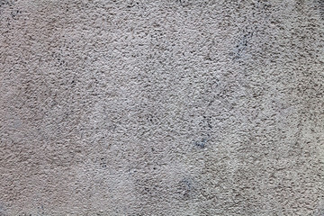 Background and texture of a granite rough wall in a rock of a mountain for decor and interior decoration. Design and patterns.