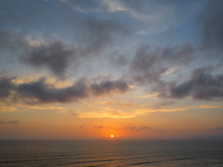 Obraz premium View of a sunset on the coast of the city of Lima