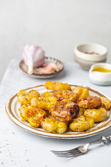 Homemade baked smashed baby potatoes with garlic, salt and herbs