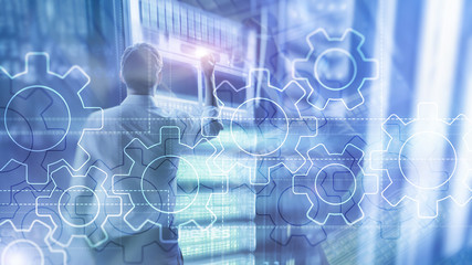 Double exposure gears mechanism on blurred background. Business and industrial process automation concept.