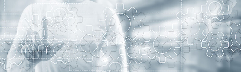 Obraz premium Best media technologies. Gears mechanism on panoramic business background.