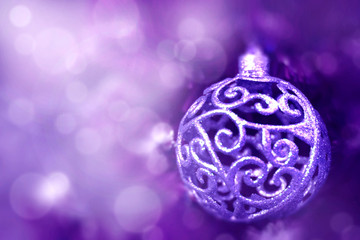 Christmas ball on tree. Closeup on Christmas tree decoration over festive background