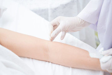 Therapy of female arm with pricking acupuncture needle