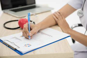 successful doctor takes notes on a notepad