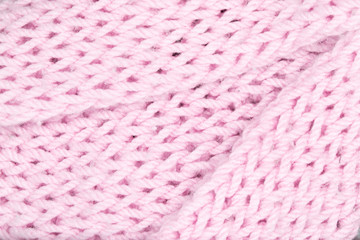 Pink wool knitted texture background.