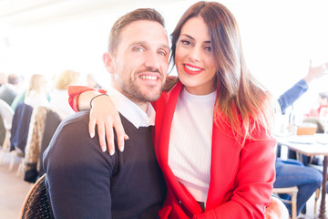 Young beautiful couple in love smiling happy and giving affection to each other