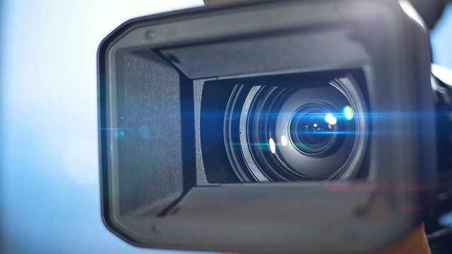Video camera lens opens, lens movement with lens flare, TV saver
