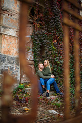 Beautiful couple walking down the street in sweaters and jeans