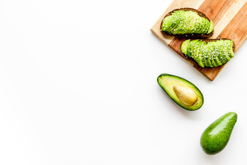 Healthy food. Avocado toast on white background top view frame copy space