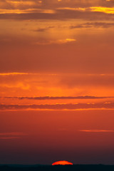 Fantastic clouds at sunrise, vertical panorama