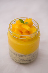 Chia pudding and mango smoothie with decoration mango