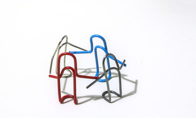 friendly company of multi-colored paperclips fun dancing