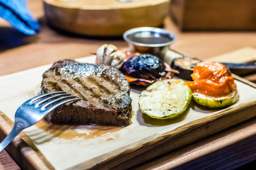 Food. meat steak with grilled vegetables. horisontal