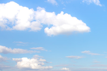 Blue sky and soft white clouds at day time for background.