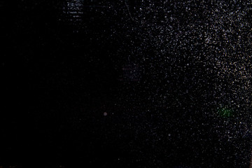 Fototapeta na wymiar Abstract dust explosion on a black background