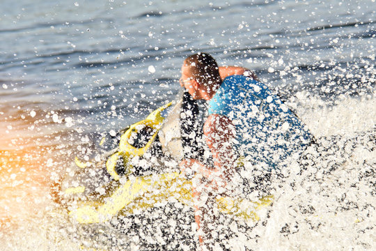 man on a jet ski in the spray of waves blurred image, letl, sea, water entertainment, summer