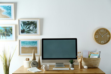 Modern computer and office supplies on wooden table, space for text. Designer's workplace