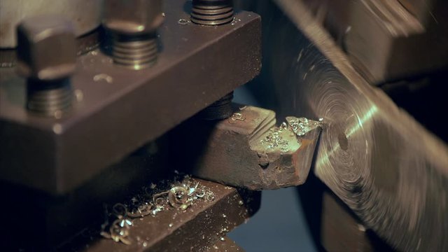 Closeup shot of a tool cutting metal at a factory in India. Indian stock video of an industrial tool cutting metal at a plant in India