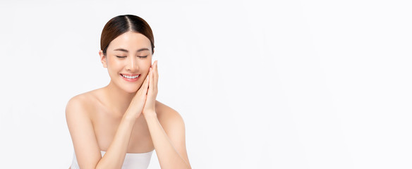 Beauty shot of bright skin smiling Asian woman on white banner background