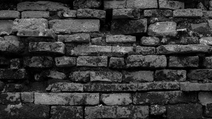 Old brick wall with vignetting of dark or black blur border gradient in bw or black and white tone for backdrop or background.