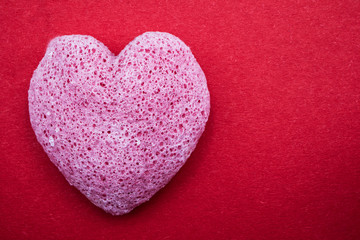 Obraz premium Pink Valentines heart with board to write, red background. Happy Valentines Day