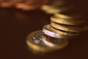 Various Belarusian coins on a dark surface close-up. Money background retro style toned